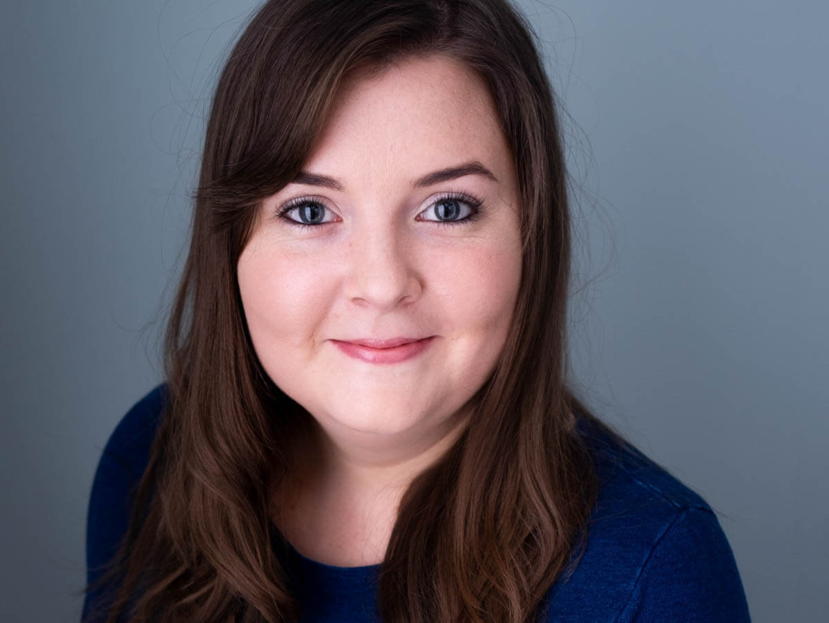 happy-woman-mortgage-advisor-business-headshot-lighting