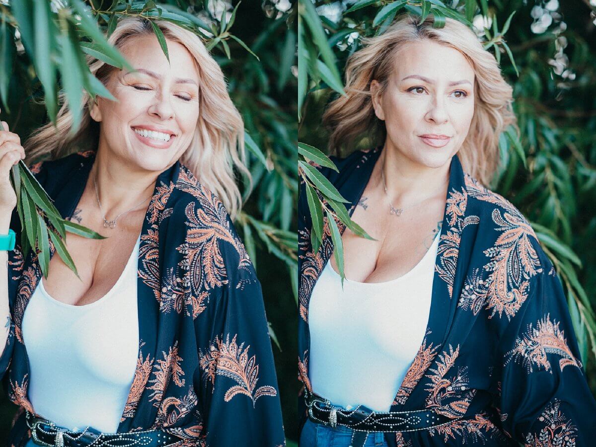 mature woman laughs as wind blows blonde hair