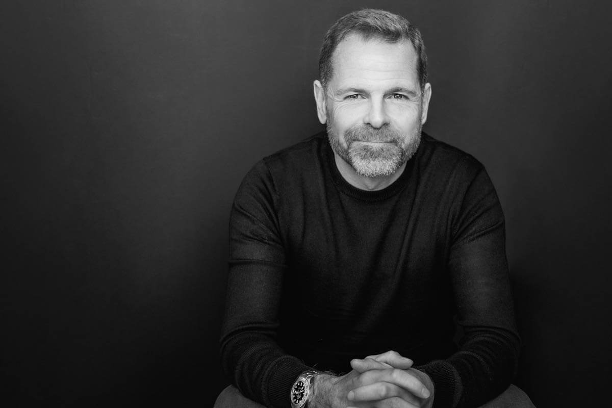 charming man beard executive coach black and white photo