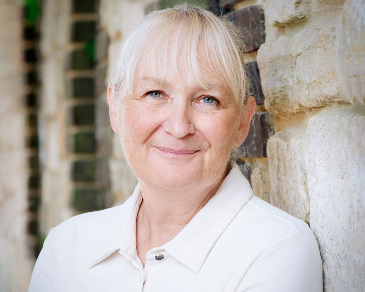smiling older woman corporate photographer coaching session