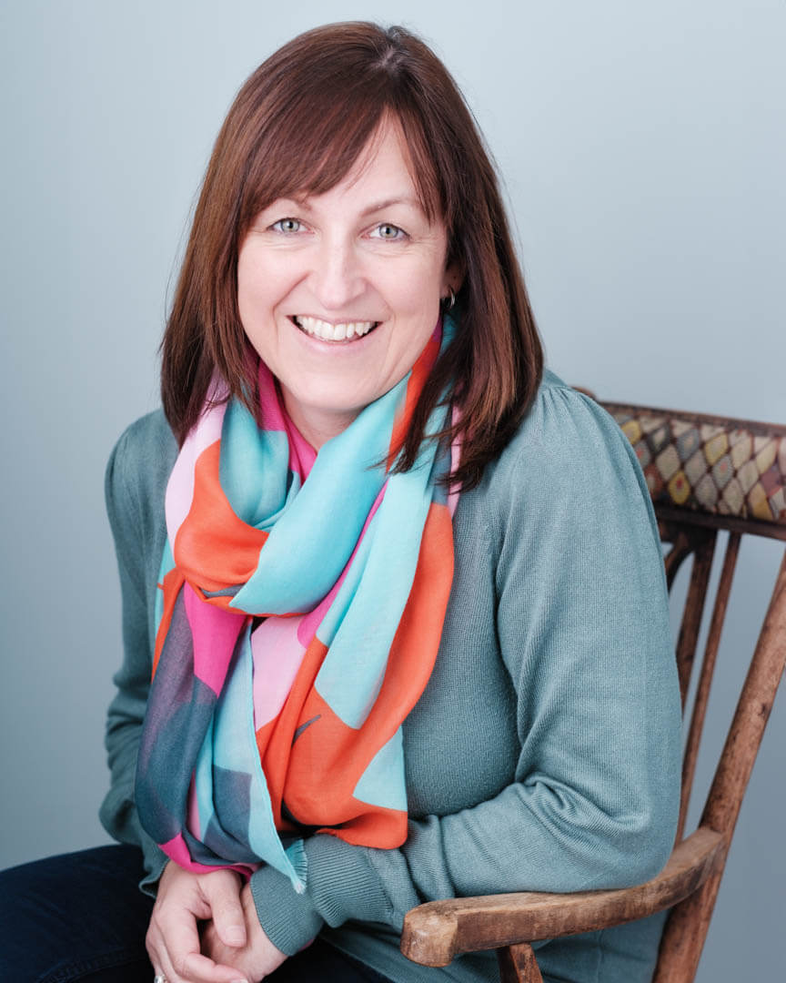 studio headshots for a CEO who smiles and laughs